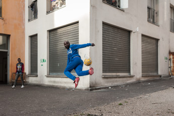 Diallo is a tailor, a cooker and a keen football player. His workshop, where he also sleeps, is on the ground floor of the orange building, the most crowded of the four Ex MOI buildings. Turin.