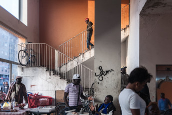 In 2017, the ex MOI is home to almost 1,400 migrants and refugees from 28 different sub-Saharan African countries. At the beginning of the occupation, coexistence proved difficult due to deep ethnic differences, but with time, things have changed a lot. A group of boys on an ordinary day. Turin.