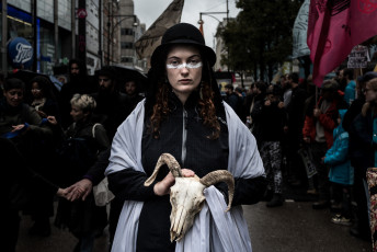 An activist from Extinction Rebellion London stages a performance with her affinity group featuring animal skeletons symbolizing the sixth mass extinction and the funeral of our planet. London, October 12 2019.