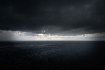 The sky closes over the sea before the arrival of a typhoon that will sweep the islands for a few hours. "...How much peace the soul finds within. The time of other laws flows slowly. Of another dimension. And I descend into an ocean of silence. Always calm...' (Battiato, Un oceano di silenzio). Tremiti, June 2024.